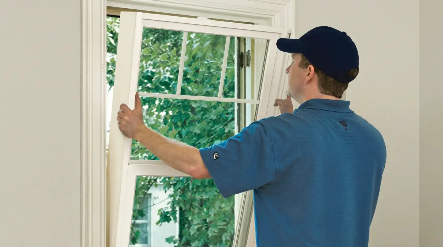 Professional contractors performing a residential window insulation and replacement service in Gilbert, AZ